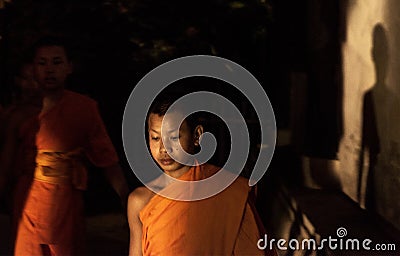 Novice Monk walking inside temple, Chiang Mai, Thailand Editorial Stock Photo